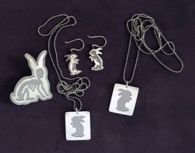 boom boom bunny brooch earrings and tags, saw pierced brushed silver and titanium, stainless